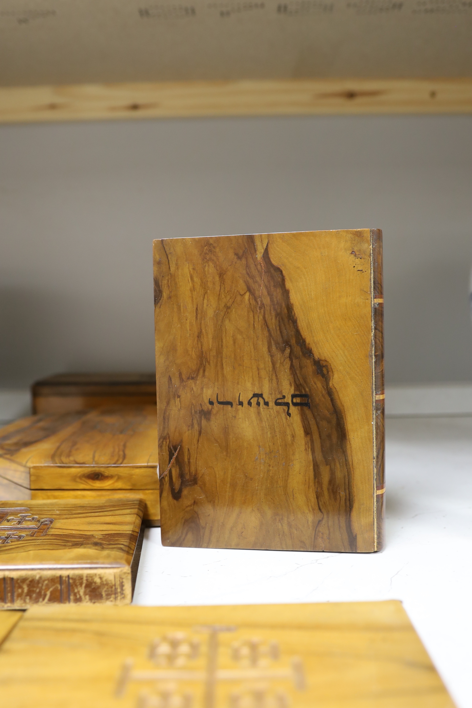 A collection of Jerusalem ware olive wood boxes, two albums, two books, etc.